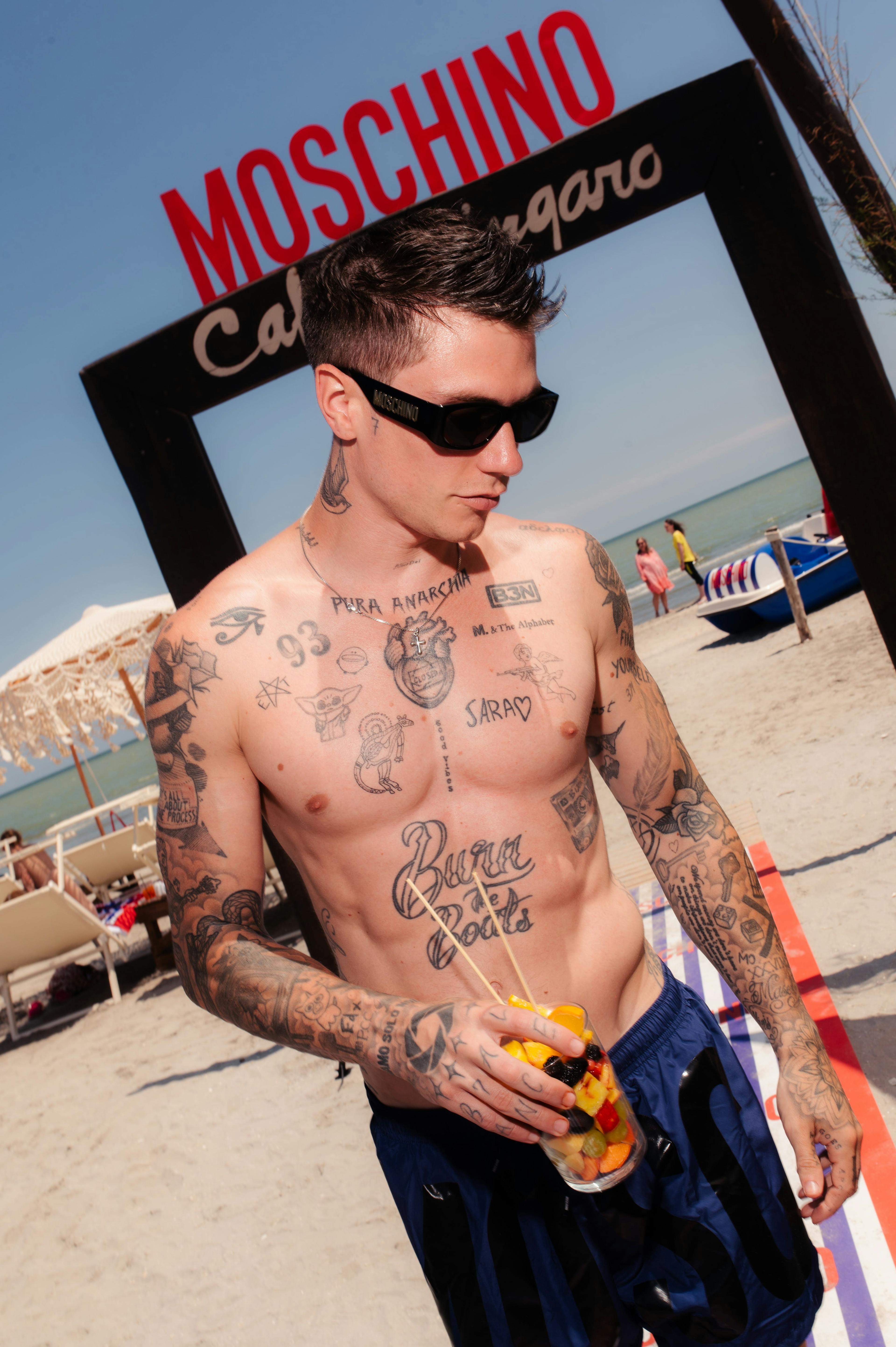 person skin tattoo back boat vehicle adult male man glasses