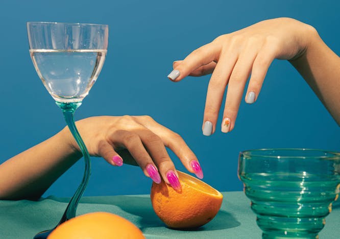 glass goblet finger hand person citrus fruit fruit orange nail grapefruit