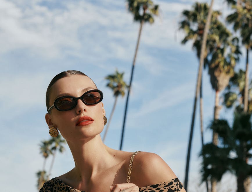 person smile adult female woman accessories sunglasses handbag tree palm tree