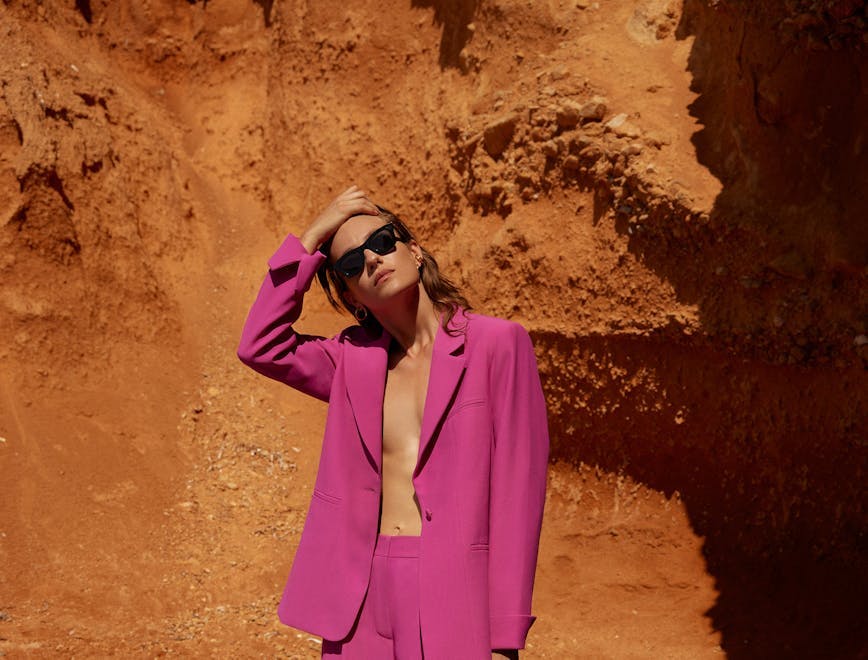 clothing apparel suit overcoat coat female person sunglasses accessories woman