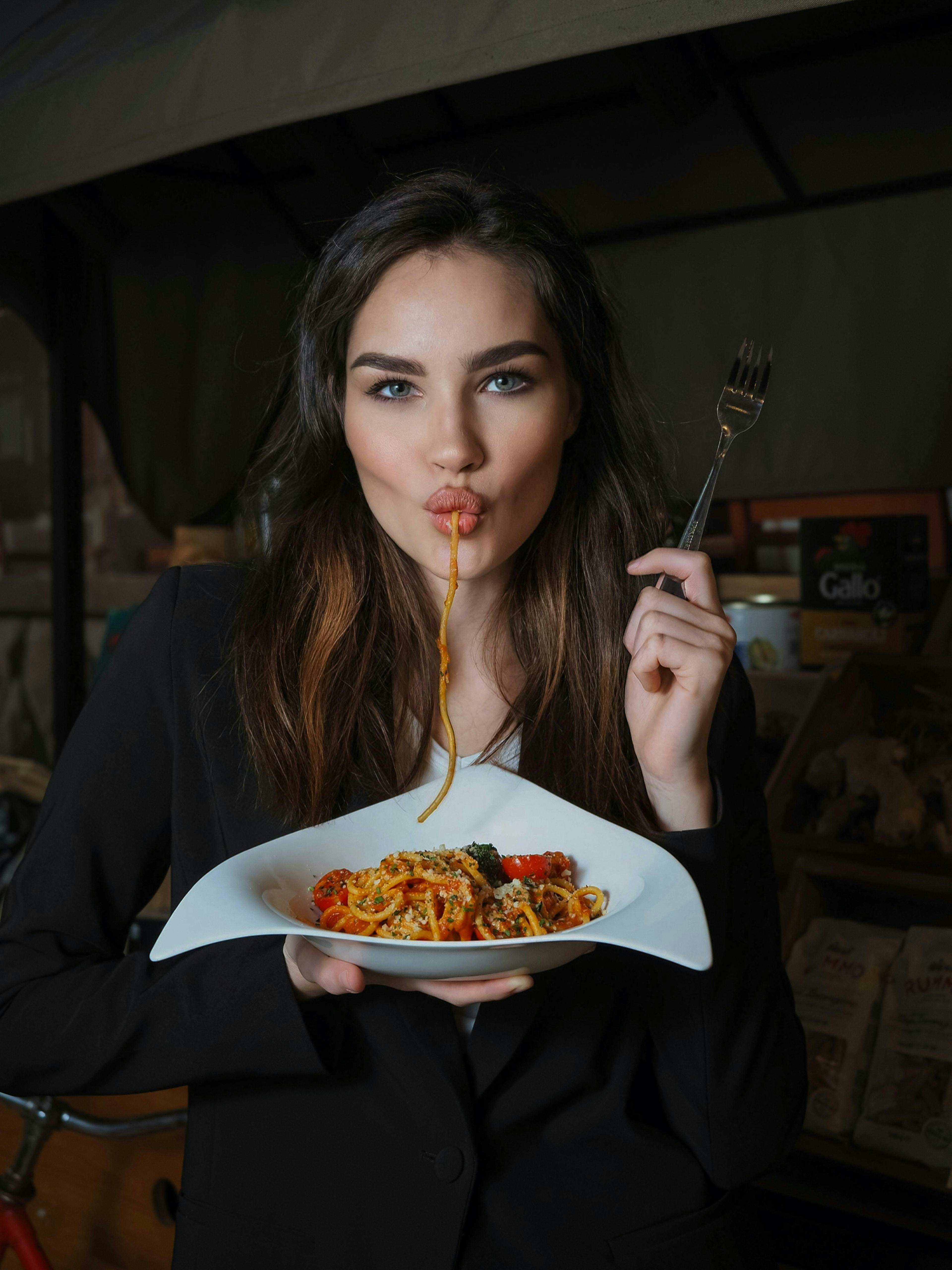 eating food person cutlery fork adult female woman