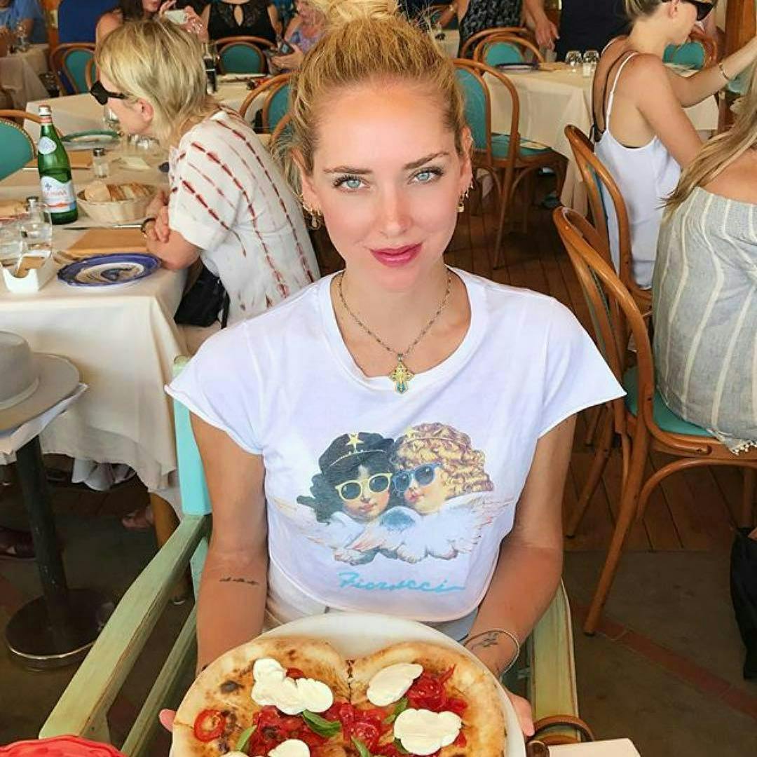 person photobombing brunch food pizza