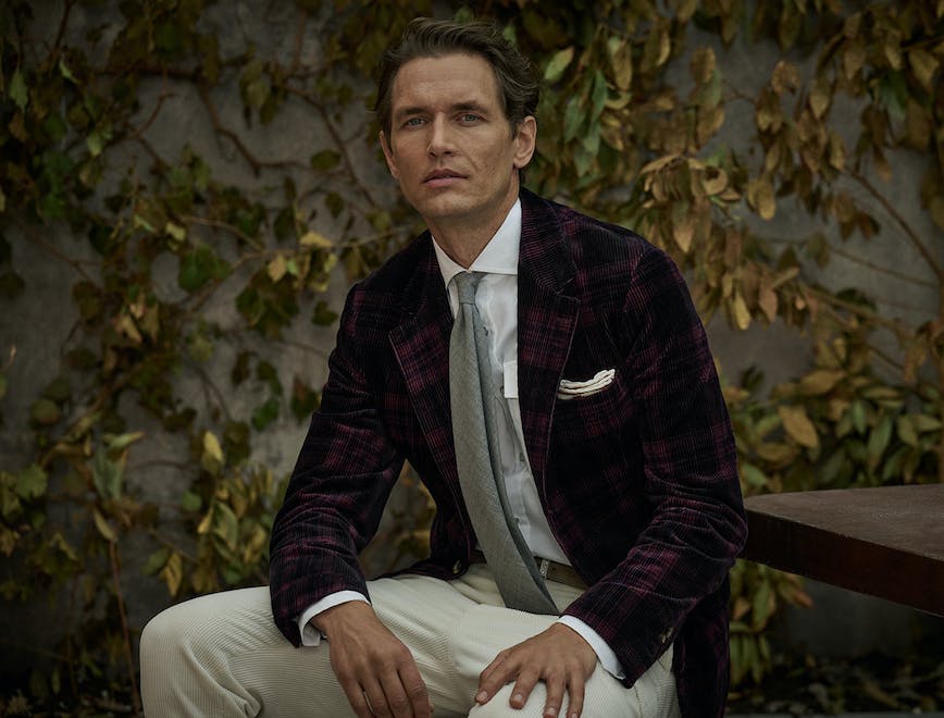 blazer coat jacket formal wear suit person sitting adult male man