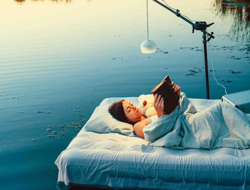 bed,forest,nightie,woman,activity,ethnicity,student,young,book,sleeping,summer,head,beautiful,swimming,hair,floating,casual,only,female,leisure,lying,toy,attractive,carefree,nature,one,relaxation,reading,lamp,brown,lifestyles,people,water,outdoors,comfortable,healthy,person,backgrounds,dawn,looking,blanket,river,adult,lake blanket person