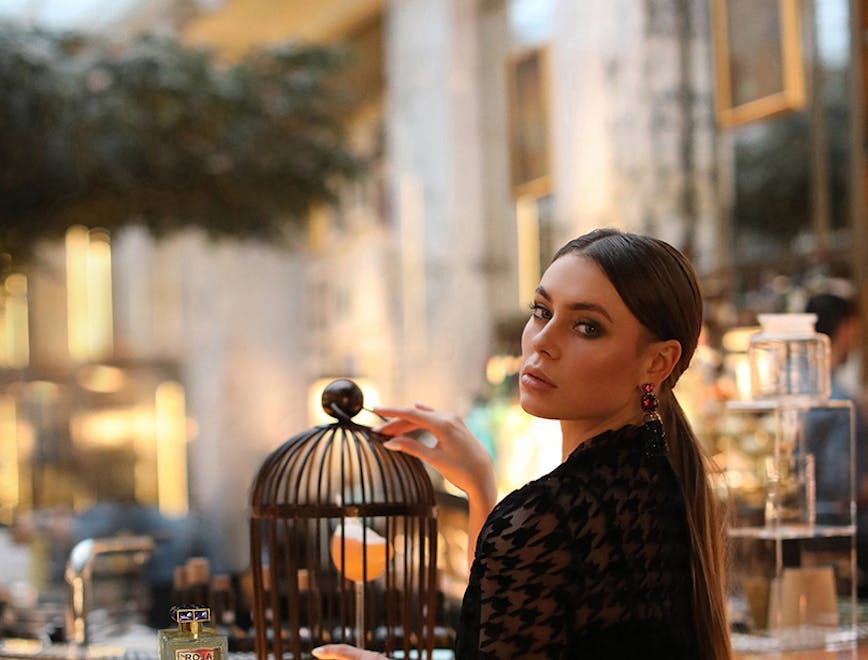 person sitting adult female woman face photography portrait perfume restaurant