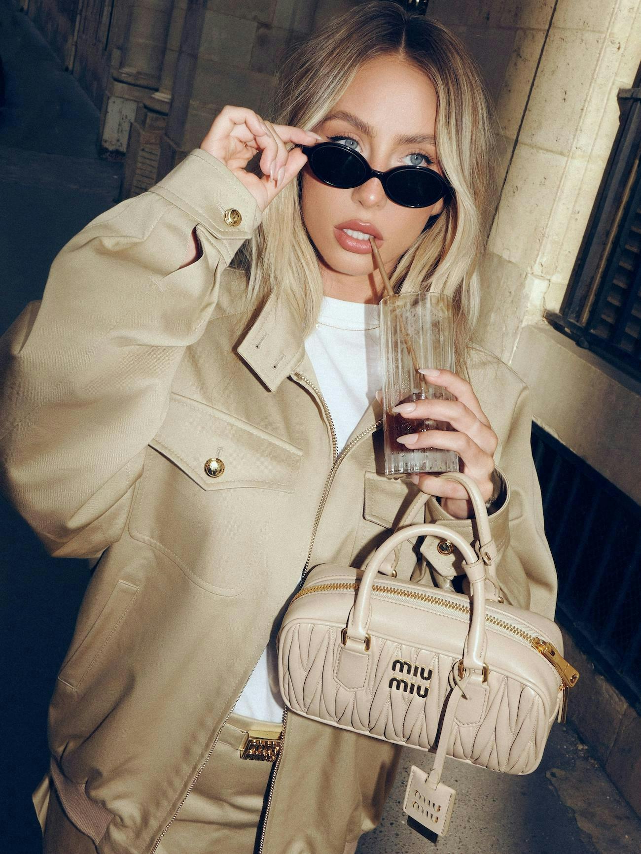 clothing coat accessories bag handbag purse overcoat jacket soda sunglasses