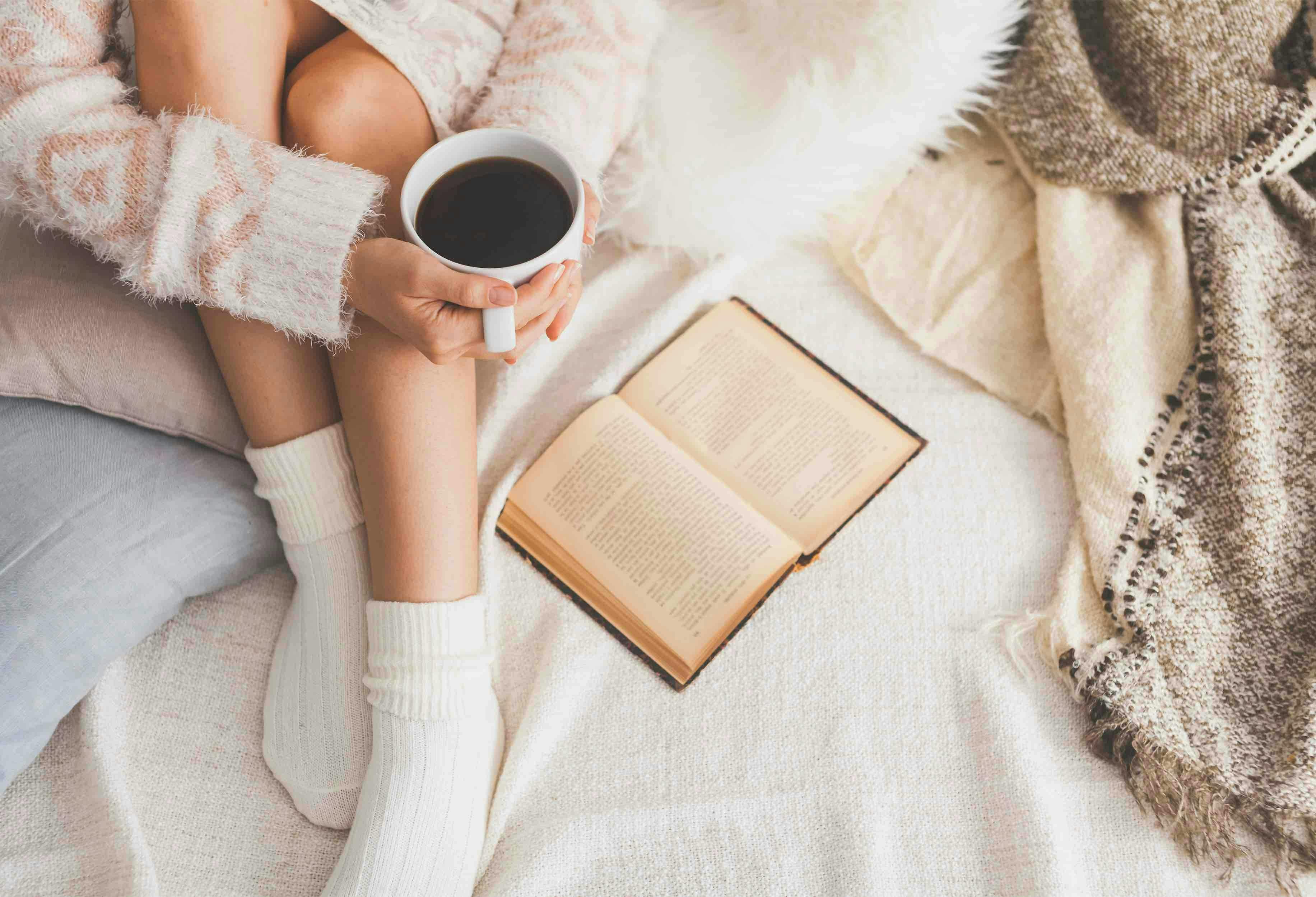 bed,wool,hands,beauty,cozy,woven,american,beautiful,view,white,legs,gentle,sweater,soft,vanilla,still,old,european,socks,girl,morning,warm,light,vintage,heated,breakfast,cup,woman,young,book,hipster,wear,winter,cold,cute,life,interior,top,indoors,teenager,rest,knitted,legwarmers,homely,bedroom,comfort,home,coffee,pillow,time,woolen book publication person reading clothing hosiery sock blanket coffee coffee cup