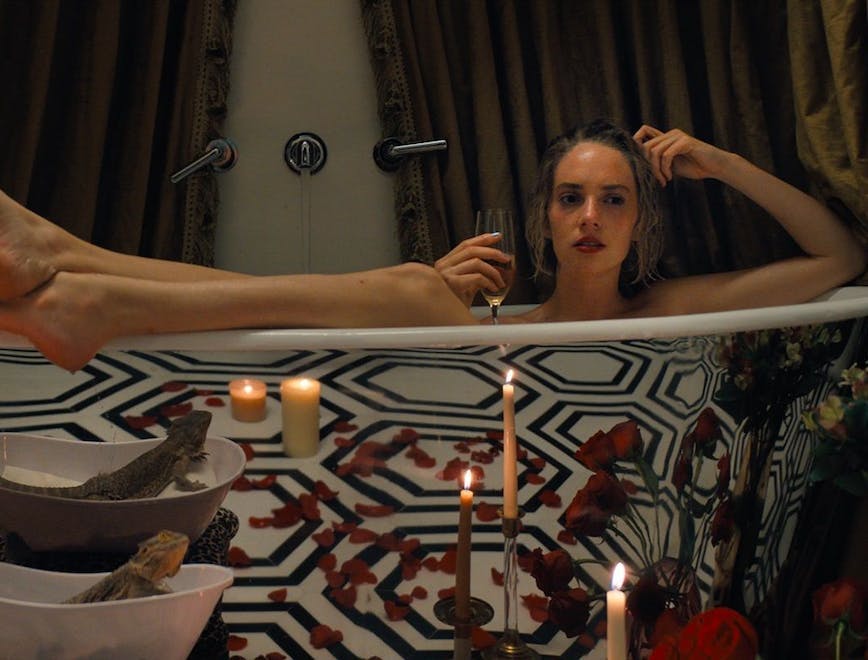 bathing bathtub person tub adult female woman face head candle