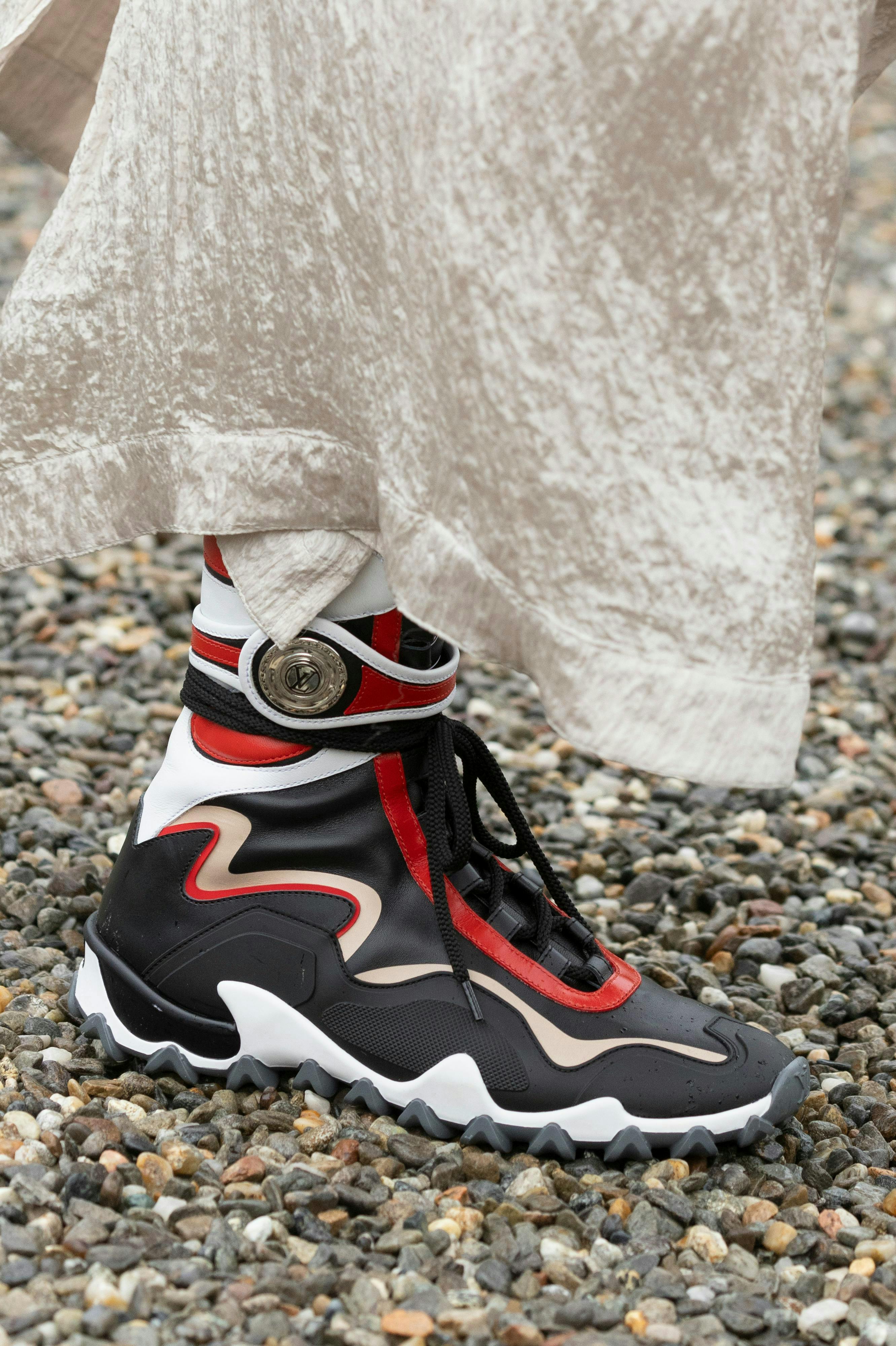 clothing footwear shoe sneaker road gravel pebble person