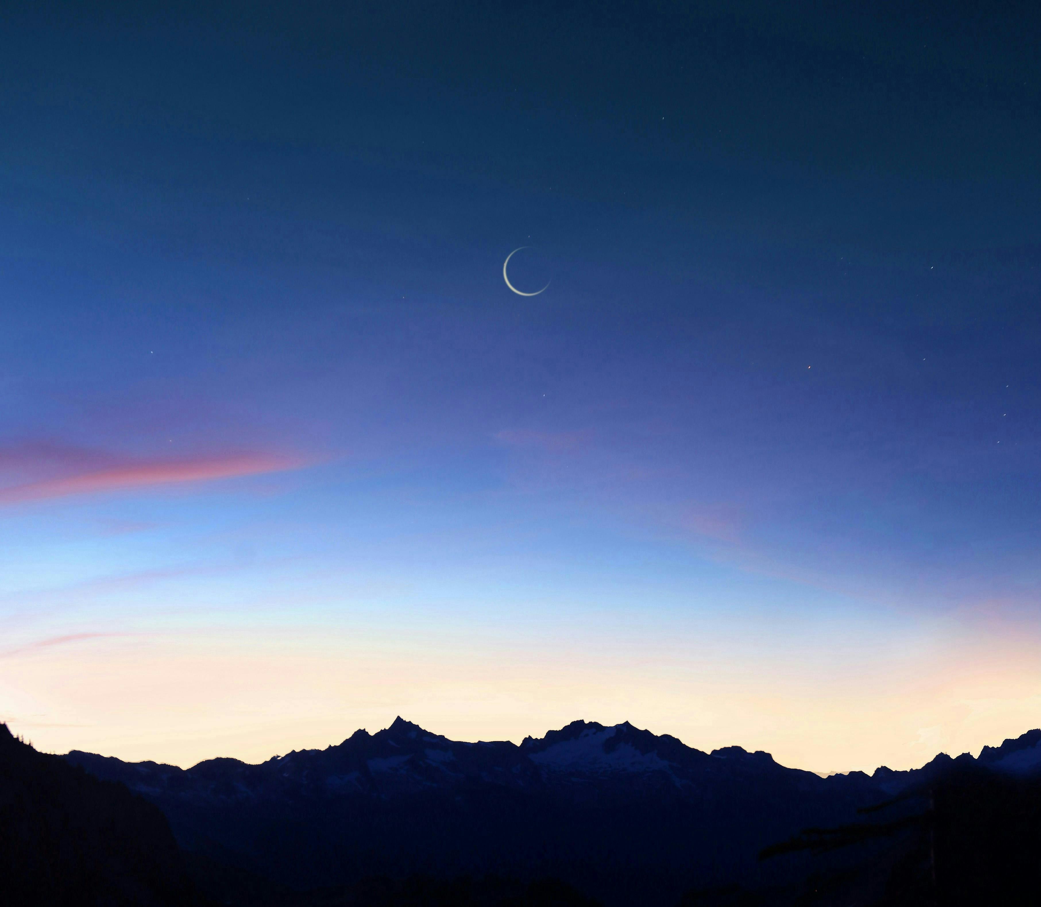 nature night outdoors sky mountain mountain range astronomy moon scenery sunset