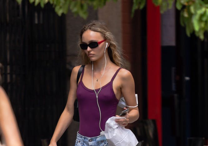 new york clothing shorts pedestrian person bag handbag glasses shoe vest mobile phone